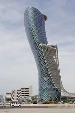 Capital Gate The building is owned and was developed by the Abu Dhabi National Exhibitions Company.