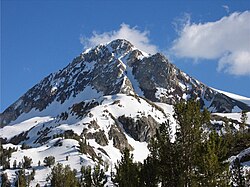 Red Slate Mountain (elevation 13,156 ft or 4,010 m) is still covered with snow in June.