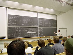 Students attend a linear algebra lecture at a tertiary institution: Helsinki University of Technology in Finland.