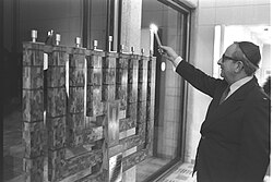 President Yitzhak Navon lighting Hanukkah menorah