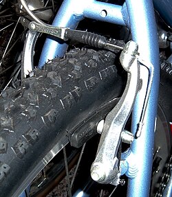 Linear-pull brake, also known by the Shimano trademark: V-Brake, on rear wheel of a mountain bike