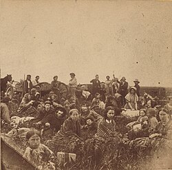 Mixed Dakota-Europeans who were rescued by "non-hostile" Dakota. The girl in the foreground wrapped in the striped blanket is Elise Robertson, the sister of Thomas Robertson, a mixed blood who acted as an intermediary between the Dakota and the European-Americans during the Dakota War of 1862