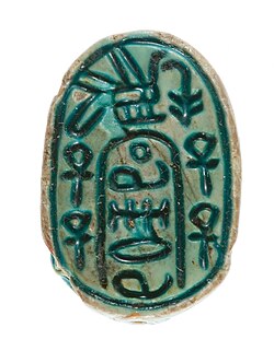 Canaanite Anra scarab showing Egyptian nswt-bjt and ankh symbols bordering a cartouche with an undeciphered sequence of hieroglyphs, c. 1648–1540 BC