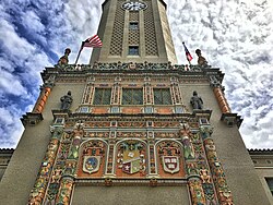 Tower at the University of Puerto Rico, showing the emblem of Harvard (on right), the oldest in the United States, and that of National University of San Marcos, Lima (left), the oldest in the Americas