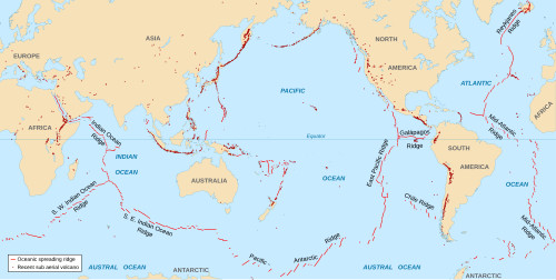 Map showing the divergent plate boundaries (oceanic spreading ridges) and recent sub-aerial volcanoes (mostly at convergent boundaries)