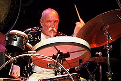 Günter Sommer with bodhrán and bongo drums in his kit.