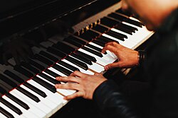 A pianist playing a piano