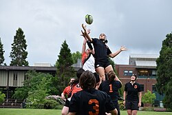 A rugby lineout being conducted. A group from either team lifts a player to fight and catch the ball for their team. (OSUWRC 2014)