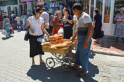 Bread vendor in a market street of Tashkent
