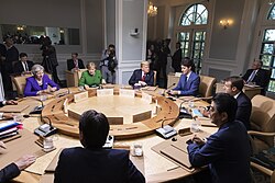 Macron with Donald Trump, Angela Merkel, Justin Trudeau, Shinzo Abe and other leaders at the 2018 G7 summit in Charlevoix, Quebec