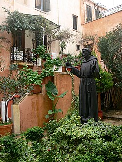 Statue of St. Francis in front of the Catholic church of Chania