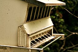 An empty bird-seed dispenser