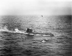 B-59 near Cuba with a U.S. Navy helicopter circling above, c. October 28–29, 1962