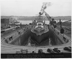 Dry Dock No. 4. View from North showing USS Mississippi, first ship docked in completed Dry Dock No. 4