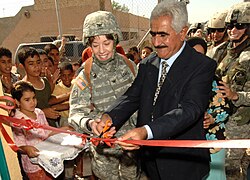 Celebratory proceedings in 2006 for the opening of a new women's center in Iraq, constructed by the Corps of Engineers