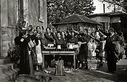 Sección Femenina volunteers do the Roman salute before delivering food for the needy in 1937.