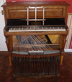 An upright pedal piano by Challen