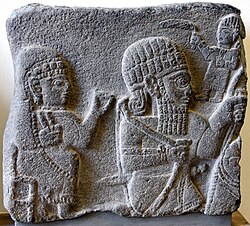 Fragment of a basalt stele showing a woman and a horse rider, Probably from Kahramanmaraş. 8th century BCE. Pergamon Museum.