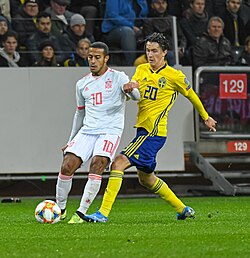 Thiago on the ball against Kristoffer Olsson for Spain against Sweden in 2019
