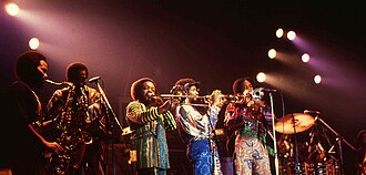 Funk horn sections typically include saxophones and trumpets. Larger horn sections often add a second instrument for one of the saxes or trumpets, and a trombone or bari sax may also be used. Pictured is the Earth, Wind and Fire horn section.