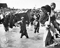 Palestine refugees initially displaced to Beach camp in Gaza board boats to Lebanon or Egypt during the 1948 war