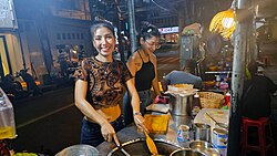 Street food vendor "Puy the Roti Lady" – "Benjawan Kaewsaen" and her sister Palm in the Silom – Saladang area of Bangkok