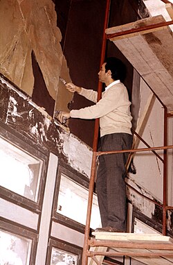 Tàpies working on a wall painting at the University of St. Gallen, 1962