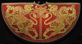 The Coronation Mantle of Roger II of Sicily, silk dyed with kermes and embroidered with gold thread and pearls. Royal Workshop, Palermo, Sicily, 1133–34. Imperial Treasury, Vienna.
