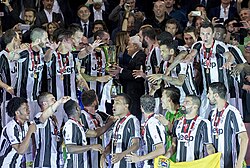 Juventus captain Giorgio Chiellini receiving the 2016–17 Coppa Italia from Sergio Mattarella, the president of Italy