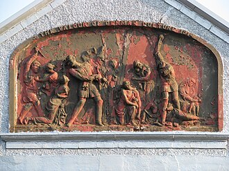 The Valour of German Culture 1914 (aka Kultur Panel),[b] 1915, terracotta bas-relief by William Baxter (1855–1927), 128 Pitt Street, Bonnington, Edinburgh – depicting eighteen figures: German soldiers ("Huns") committing acts of violence against Belgian civilians, including women and children. One soldier is wearing an Iron Cross.