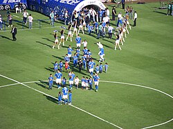 Players entering the pitch through a tunnel formed by Las Celestes, before the match against Atlante on 28 February 2009.