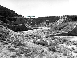 Eroded alluvial fill 60 feet (18 m) thick at Kanab Creek, Kane County, Utah. In 1884 the stream ran at top of the terrace. 1939 photo by United States Geological Survey.