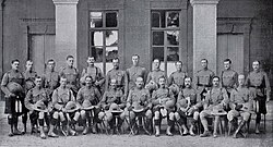 Officers of the 1st Battalion, Queen’s Own Cameron Highlanders, pose in Cairo, Egypt, before embarkation for South Africa, 1900. The central figure, seated and wearing boots and breeches, is Lieutenant Colonel Watson-Kennedy.