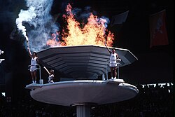 Kim Won-tak (athlete), Chong Son-man (teacher) and Son Mi-jong (dance student) during the lighting of the 1988 Summer Olympic cauldron