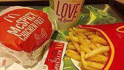 French fries, a soft drink, McSpicy Chicken Fillet, and tomato ketchup packet