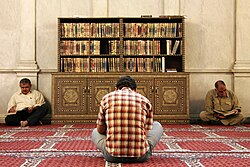 Muslim men reading the Quran in the Umayyad Mosque of Damascus
