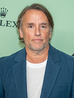 Linklater, neutrally looking at the camera
