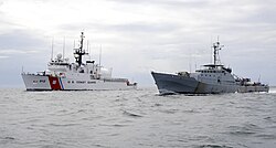 Senegalese patrol vessel Poponquine training with a United States Coast Guard vessel off the coast of Senegal