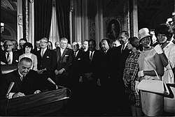 President Lyndon B. Johnson signs the Voting Rights Act of 1965
