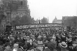 Anti-Nazi march of the SPD in Berlin, 1930. The sign reads: "Nazi victory will lead Germany to a civil war."