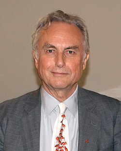 Photo of a man with gray hair wearing a suit
