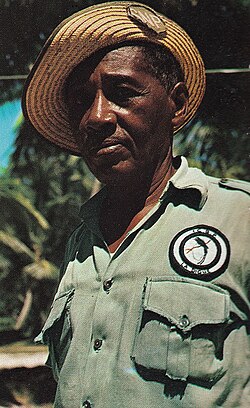 A warden with an ICBP mark on his uniform on La Digue, Seychelles in the 1970s