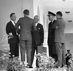 President Kennedy and his advisors discuss the Cuban Missile Crisis. Part of the US response to Soviet missiles being placed in Cuba was a naval blockade of the island.