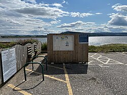 Glass recycling bin in the North Kessock Carpark on 29 July 2024