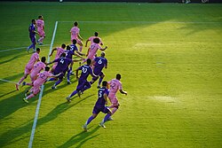 Orlando City and Inter Miami players race for an incoming ball in 2025
