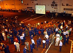 The game is shown aboard the USS John C. Stennis in the Persian Gulf.