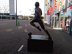 Cruyff's statue at the main entrance of the Johan Cruijff Arena in Amsterdam