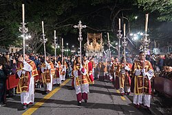 Members of the Cofradía de los Gitanos [es] parading the "throne" of Mary of the O during the Holy Week in Malaga, Spain
