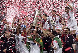 Players and staff of Sevilla celebrating the UEFA Cup victory in 2006