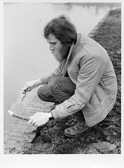 Lawrence Weiner constructing his work, THE RESIDUE OF A FLARE IGNITED UPON A BOUNDARY (1969) in Amsterdam
